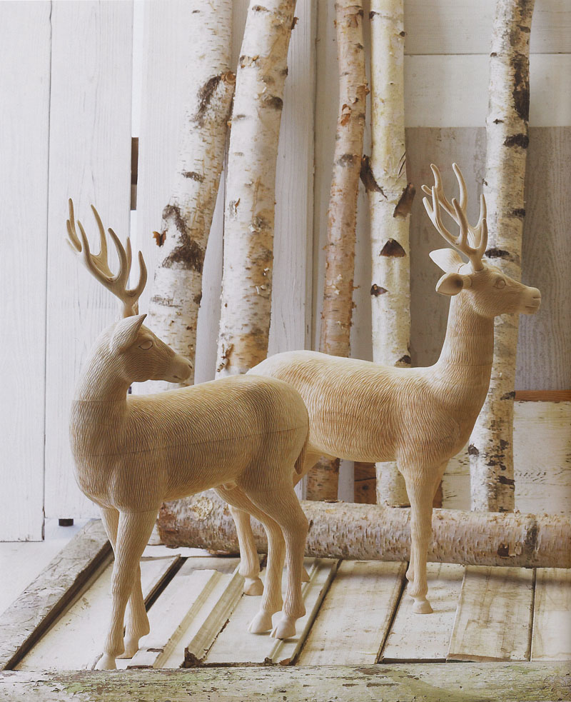 large wooden deer sculpture